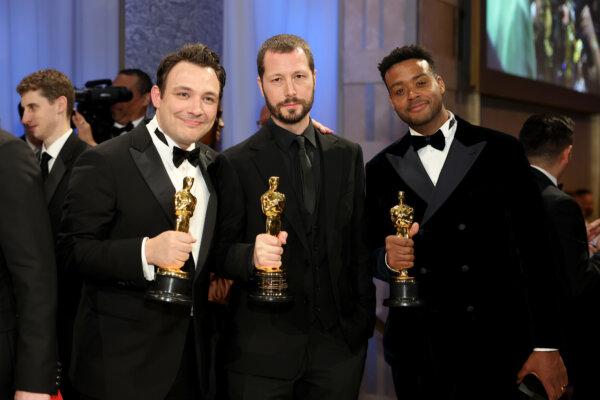 Ben Proudfoot (L) and Kris Bowers (R), winners of the Best Documentary Short Film award for “The Last Repair Shop” and Mstyslav Chernov, winner of the Best Documentary Feature Film award for “20 Days in Mariupol” (C) attend the Governors Ball during the 96th Annual Academy Awards at Dolby Theatre in Hollywood, Calif., on March 10, 2024. (Mike Coppola/Getty Images)