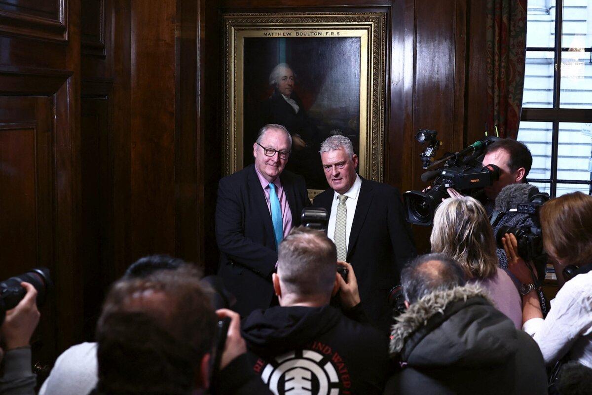 Former Conservative deputy chairman Lee Anderson (R) poses for pictures with London mayor candidate for Reform UK party Howard Cox following a press conference to announce his defection from the Conservative Party to Reform UK, in London, on March 11, 2024. (Henry Nicholls/AFP via Getty Images)