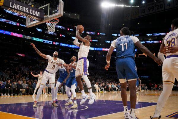 Los Angeles Lakers forward LeBron James, center, goes to the basket during the first half of an NBA basketball game against the Minnesota Timberwolves in Los Angeles on March 10, 2024. (Eric Thayer/AP Photo)