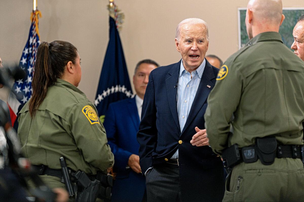 President Joe Biden speaks with a U.S. Customs and Border Protection officer during a presentation about immigration and border security at the Brownsville Station on Feb. 29, 2024, in Olmito, Texas.  (Cheney Orr/Getty Images)
