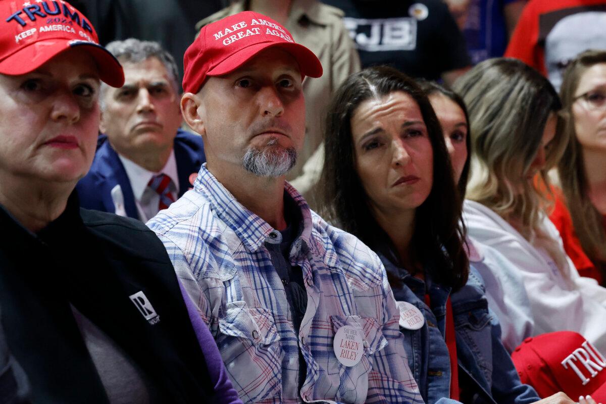 Laken Riley's parents Jason Riley (C) and Allyson Philips attend Republican presidential candidate and former President Donald Trump's campaign rally at the Forum River Center in Rome, Ga., March 09, 2024. (Chip Somodevilla/Getty Images)