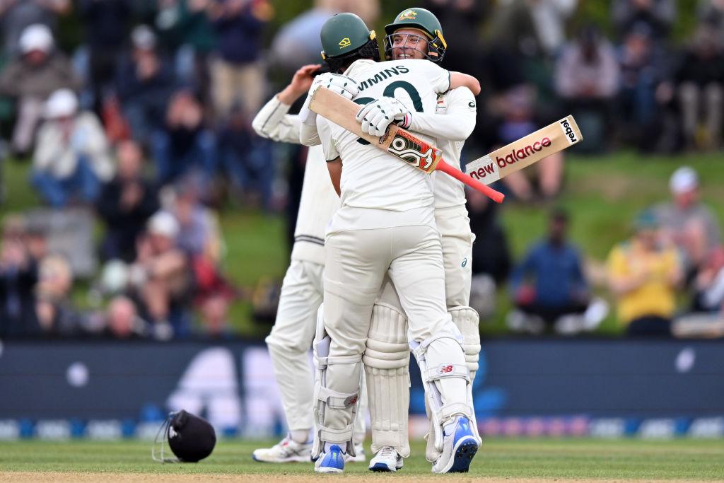 Pat Cummins and Alex Carey of Australia (L-R) celebrate their win during day four of the Second Test in the series between New Zealand and Australia at Hagley Oval in Christchurch, New Zealand on March 11, 2024. (Kai Schwoerer/Getty Images)