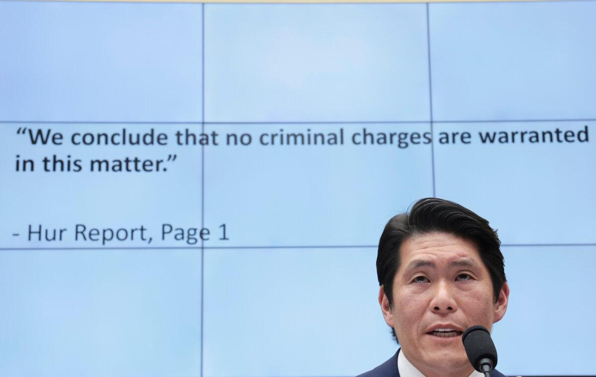 Former special counsel Robert K. Hur testifies alongside a video of former President Donald Trump to the House Judiciary Committee in Washington on March 12, 2024. (Win McNamee/Getty Images)