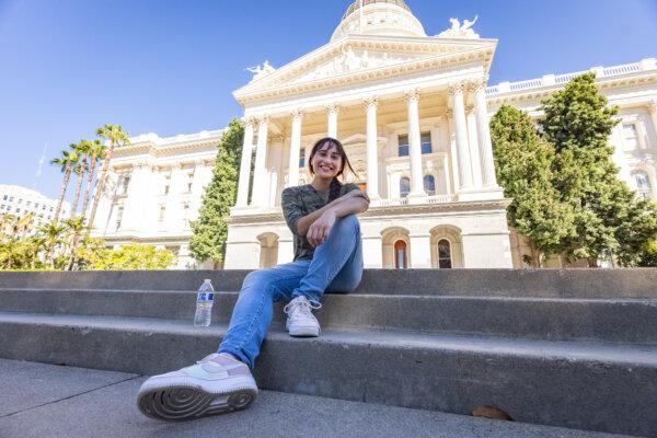 Chloe Cole sits at the California state capitol building in Sacramento, Calif., on Aug. 28, 2023. (John Fredricks/The Epoch Times)