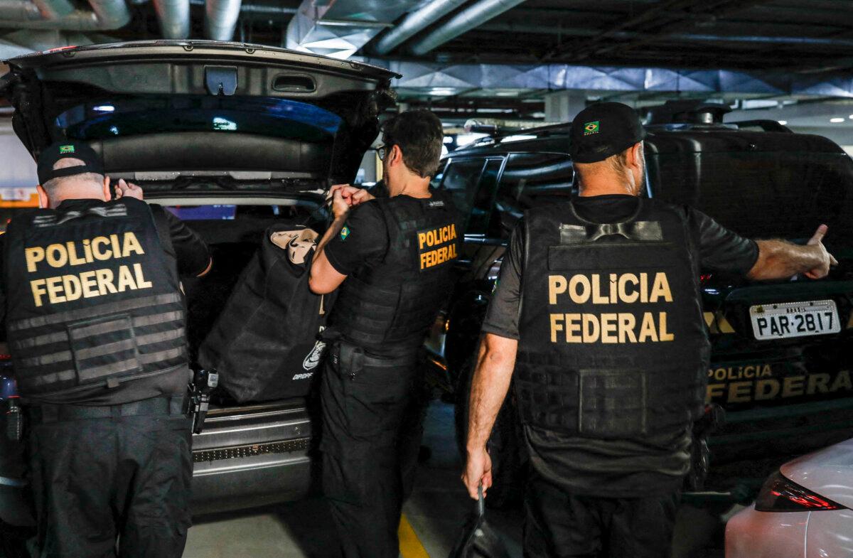 Federal police officers leave the headquarters of the Liberal Party during an operation targeting some of former President Jair Bolsonaro's top aides in Brasilia, Brazil, on Feb. 8, 2024. (Sergio Lima/AFP via Getty Images)