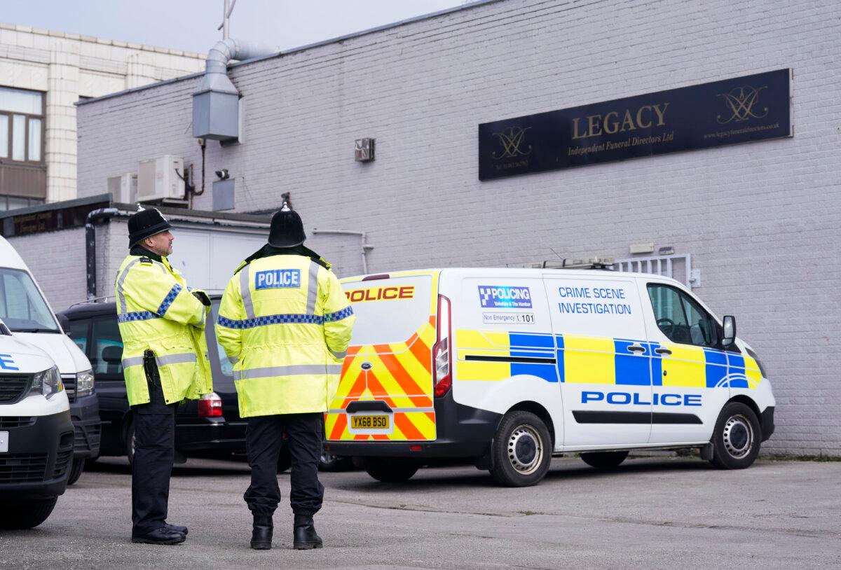 Police outside the Hessle Road branch of Legacy Independent Funeral Directors in Hull, England, on March 9, 2024. (Danny Lawson/PA Wire)