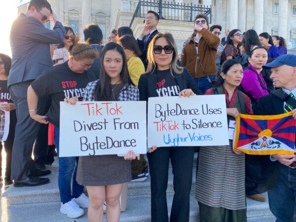 Pro-Uyghur protestors call for the passage of the TikTok divestment bill on the steps of the U.S. Capitol, on March 12, 2024. (Joseph Lord/The Epoch Times)