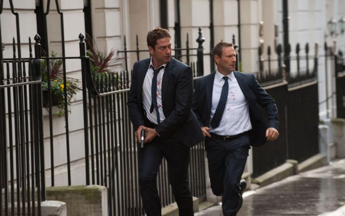 Mike Banning (Gerard Butler, L) escorts U.S. President Benjamin Asher (Aaron Eckhart), in “London Has Fallen.” (Focus Features)