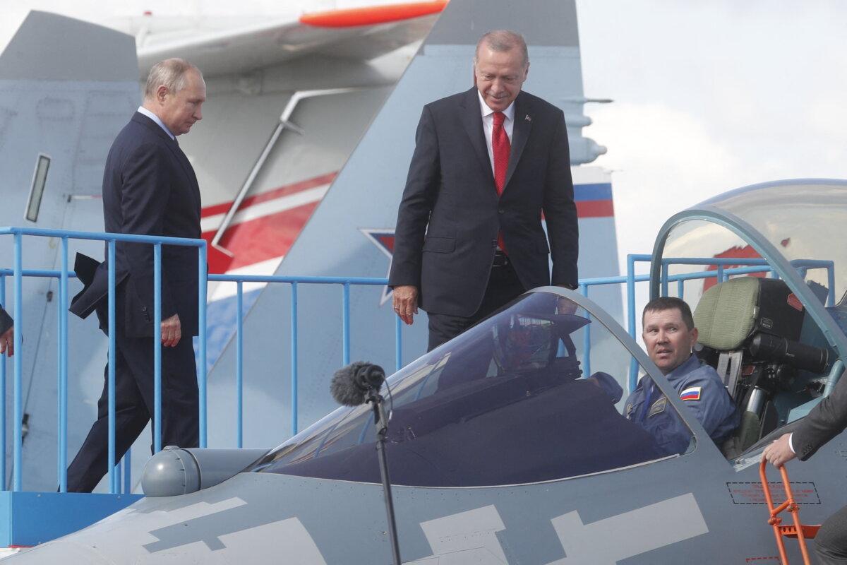 Russian President Vladimir Putin (L) and his Turkish counterpart Recep Tayyip Erdogan inspect a Sukhoi Su-57 fifth-generation fighter aircraft during the MAKS 2019 International Aviation and Space Salon opening ceremony in Zhukovsky outside Moscow, on Aug. 27, 2019. (Maxim Shipenkov/AFP via Getty Images)