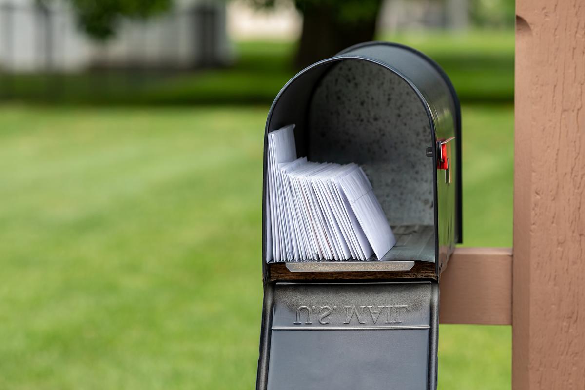 Criminals use stolen checks to commit check fraud, often from residential mailboxes or USPS collection boxes. (JJ Gouin/iStock/Getty Images Plus)