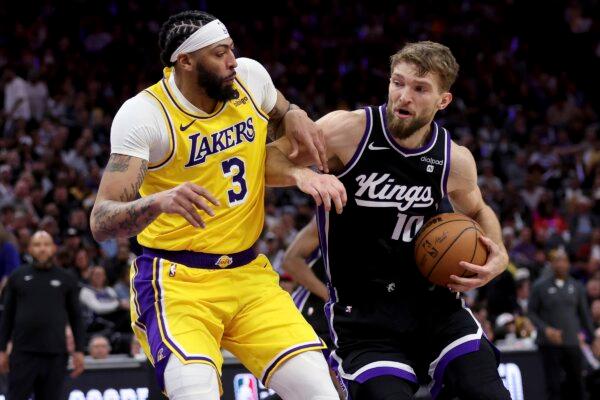 Sacramento Kings forward Domantas Sabonis (10) drives to the basket against Los Angeles Lakers forward Anthony Davis (3) during the second half of an NBA basketball game in Sacramento, Calif., on March 13, 2024. (Jed Jacobsohn/AP Photo)