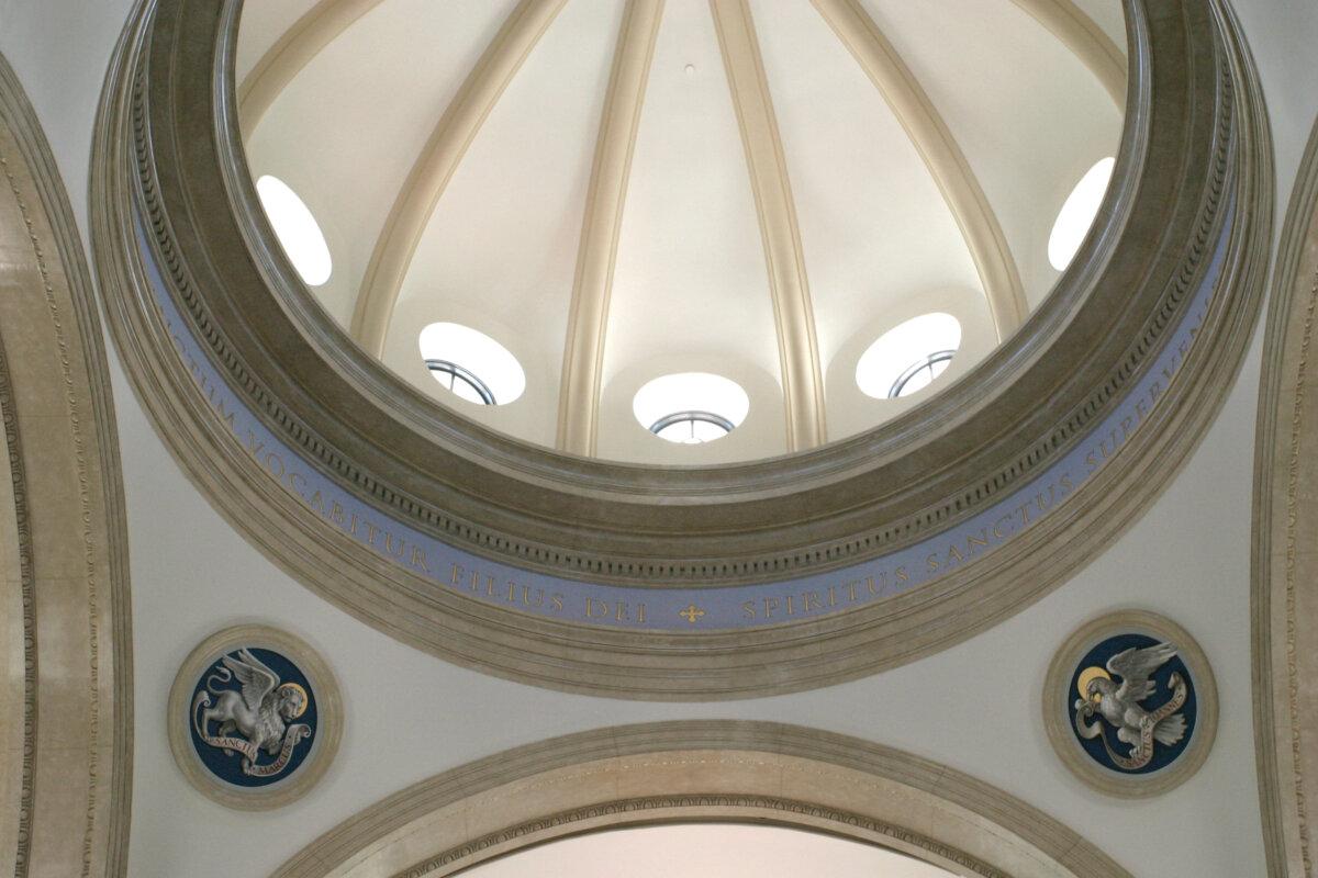 A majestic marble dome rises 89 feet above the center where the transept and nave cross. A 16-foot lantern can be seen from the outside through a row of 12 circular windows, representing the 12 apostles. (Courtesy of Thomas Aquinas College)