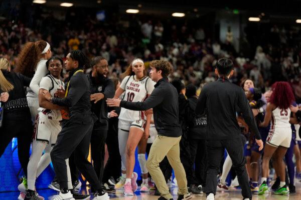 The South Carolina and LSU benches clear during the Southeastern Conference women's tournament final in Greenville, S.C. on March 10, 2024. (Chris Carlson/AP Photo)