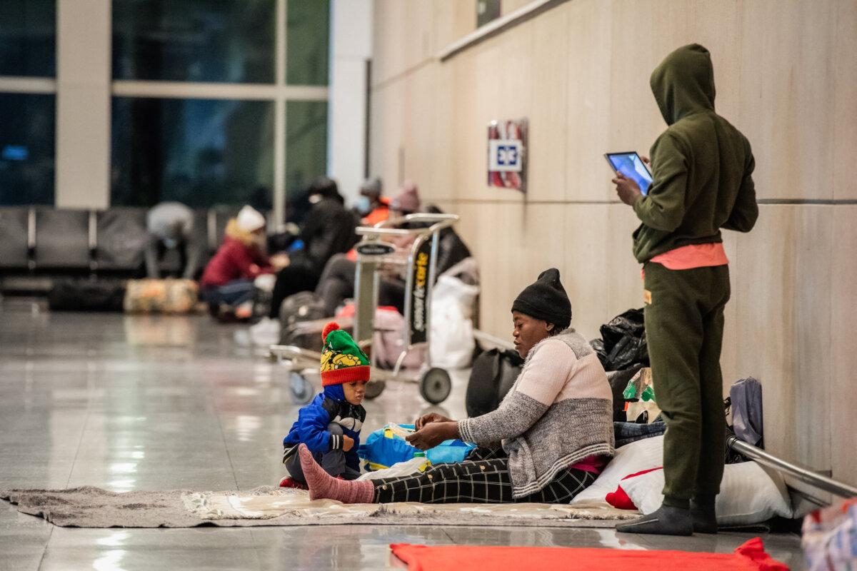 Illegal immigrants use Terminal E at Boston Logan International Airport as a shelter in Boston on Jan. 30, 2024. (Joseph Prezioso/AFP via Getty Images)