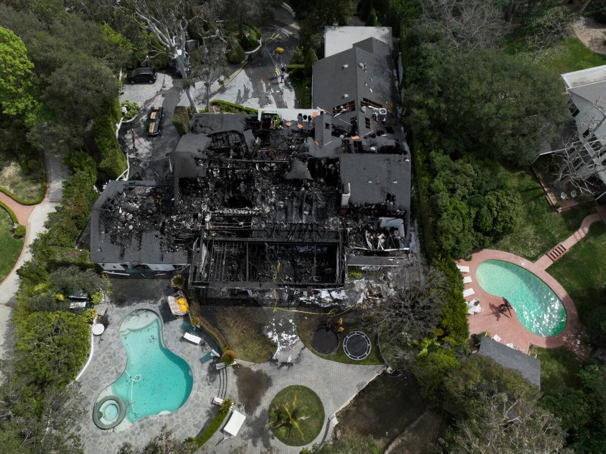 An aerial view shows a fire-damaged property, which appears to belong to Cara Delevingne, in the Studio City section of Los Angeles on March 15, 2024. (Jae C. Hong/AP Photo)