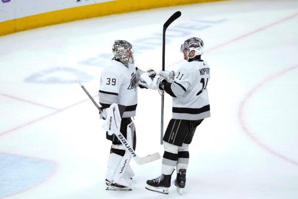 Los Angeles Kings' Anze Kopitar (11) celebrates with goaltender Cam Talbot after Talbot's 5-0 shutout of the Chicago Blackhawks in an NHL hockey game in Chicago on March 15, 2024. (Charles Rex Arbogast/AP Photo)