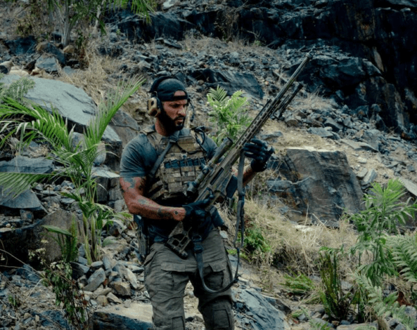Sgt. Bishop (Ricky Whittle) with a sniper rifle, in "Land of Bad." (The Avenue/Variance Films)