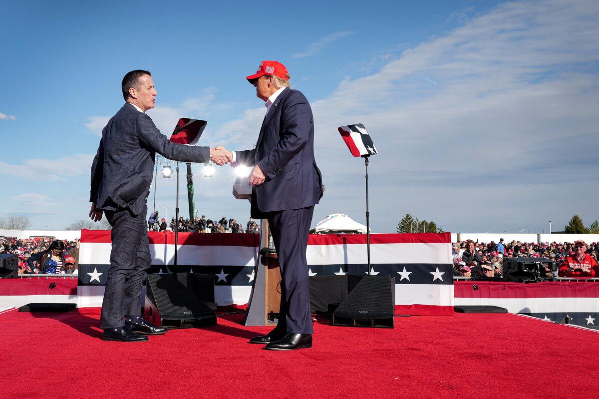 Republican presidential candidate former President Donald Trump greets Ohio Republican candidate for U.S. Senate Bernie Moreno (L) during a rally at the Dayton International Airport in Vandalia, Ohio, on March 16, 2024. (Scott Olson/Getty Images)