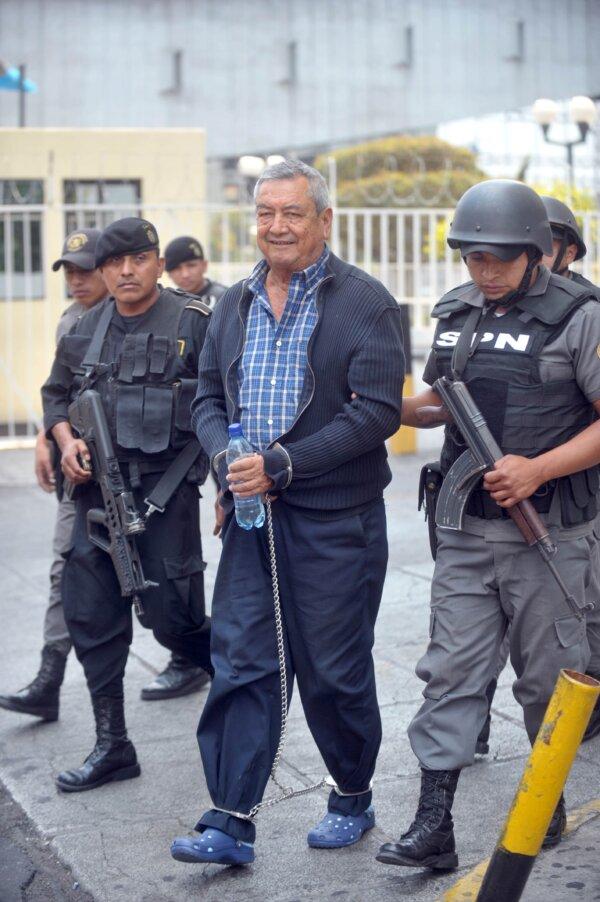 Drug trafficker Waldemar Lorenzana Lima, related to the Mexican Sinaloa drug cartel, is taken under custody on April 28, 2011, upon his arrival in Guatemala City. He faces an extradition warrant from the United States. (JOHAN ORDONEZ/AFP via Getty Images)