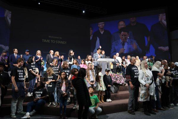 Dozens of faith-based organizations, as well as hundreds of pastors, parents, children, and community leaders, join the stage at the Time to Stand rally at the Glory Church in Los Angeles on March 16, 2024. (Sophie Li/The Epoch Times)