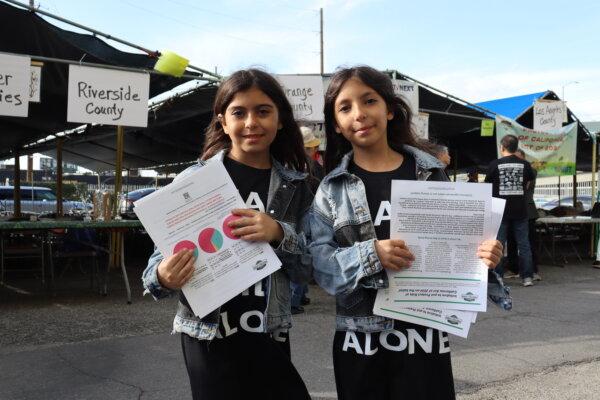 Children hold petitions for the Protect Kids of California Act of 2024 at the Time to Stand rally outside  Glory Church in Los Angeles on March 16, 2024. (May He/The Epoch Times)