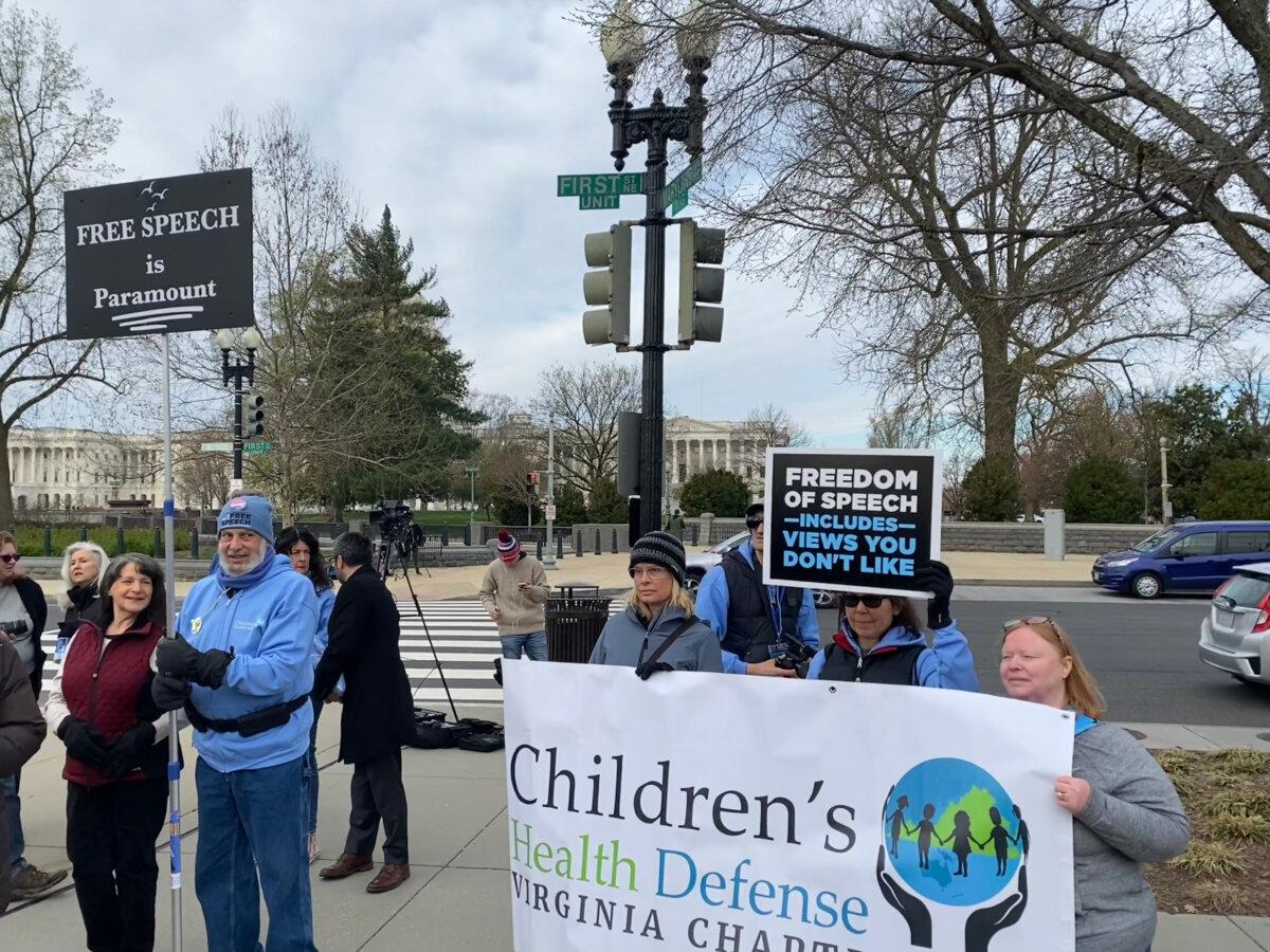 Protesters in support of free speech gather outside the Supreme Court ahead of oral arguments in a major free speech case challenging the Biden admin's pressuring of social media platforms to censor content on March 18, 2024. (Joseph Lord/The Epoch Times)