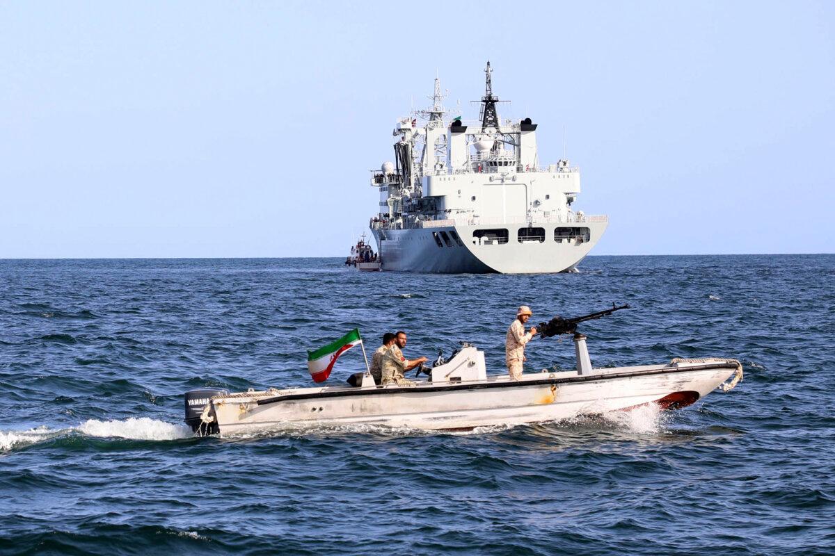 An Iranian military boat patrols as a warship enters Iranian waters before the start of a joint naval drill by Iran, Russia, and China in the Indian Ocean, on March 12, 2024. (Iranian Army via AP)