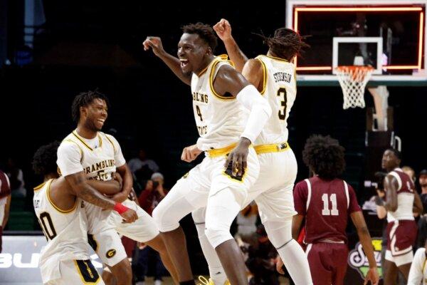 Grambling State's Antwan Burnett (4) and Mikale Stevenson (3) celebrate after beating Texas Southern in the Southwestern Athletic Conference championship game in Birmingham, Ala., on March 16, 2024. (Butch Dill/AP Photo)