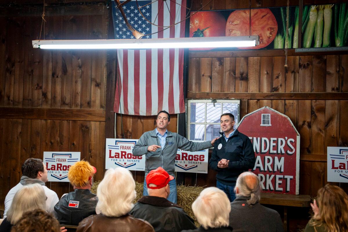 Frank LaRose (L), Ohio Republican candidate for U.S. Senate, shakes hands with Chris Banweg (R), Ohio Republican candidate for the House of Representatives, during an event ahead of the primary at the Bender's Farm in Copley, Ohio, on March 18, 2024. (Madalina Vasiliu/The Epoch Times)