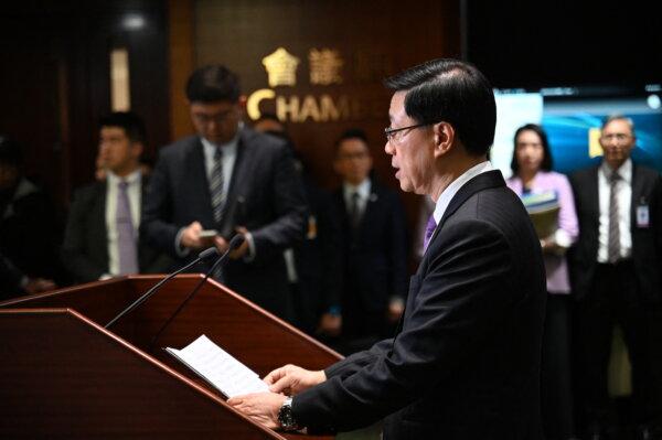 Chief Executive John Lee speaks to the media in the Legislative Council building after the passing of the Article 23 National Security Law in Hong Kong on March 19, 2024. (Peter Parks/AFP via Getty Images)