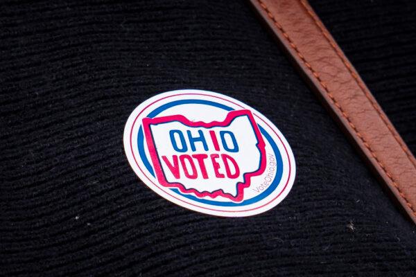 A person wears an I Voted Ohio sticker after she casts her vote at a polling place in Avon, Ohio, on March 19, 2024. (Madalina Vasiliu/The Epoch Times)