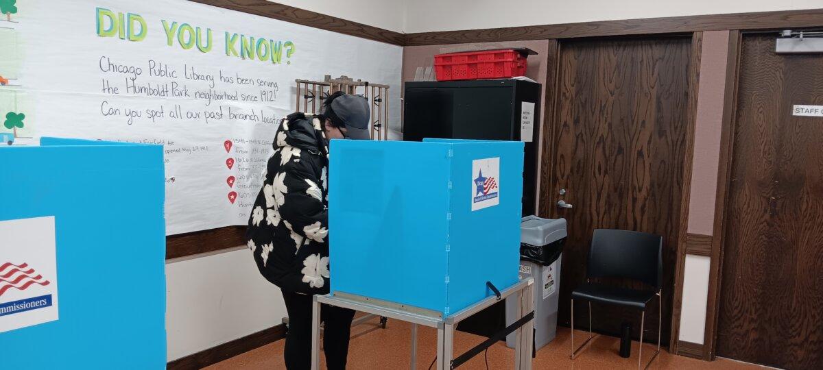 A voter at a voting location at the Humboldt Park Branch of the Chicago Public Library in Chicago, Illinois, on March 19, 2024 (Nathan Worcester/The Epoch Times).