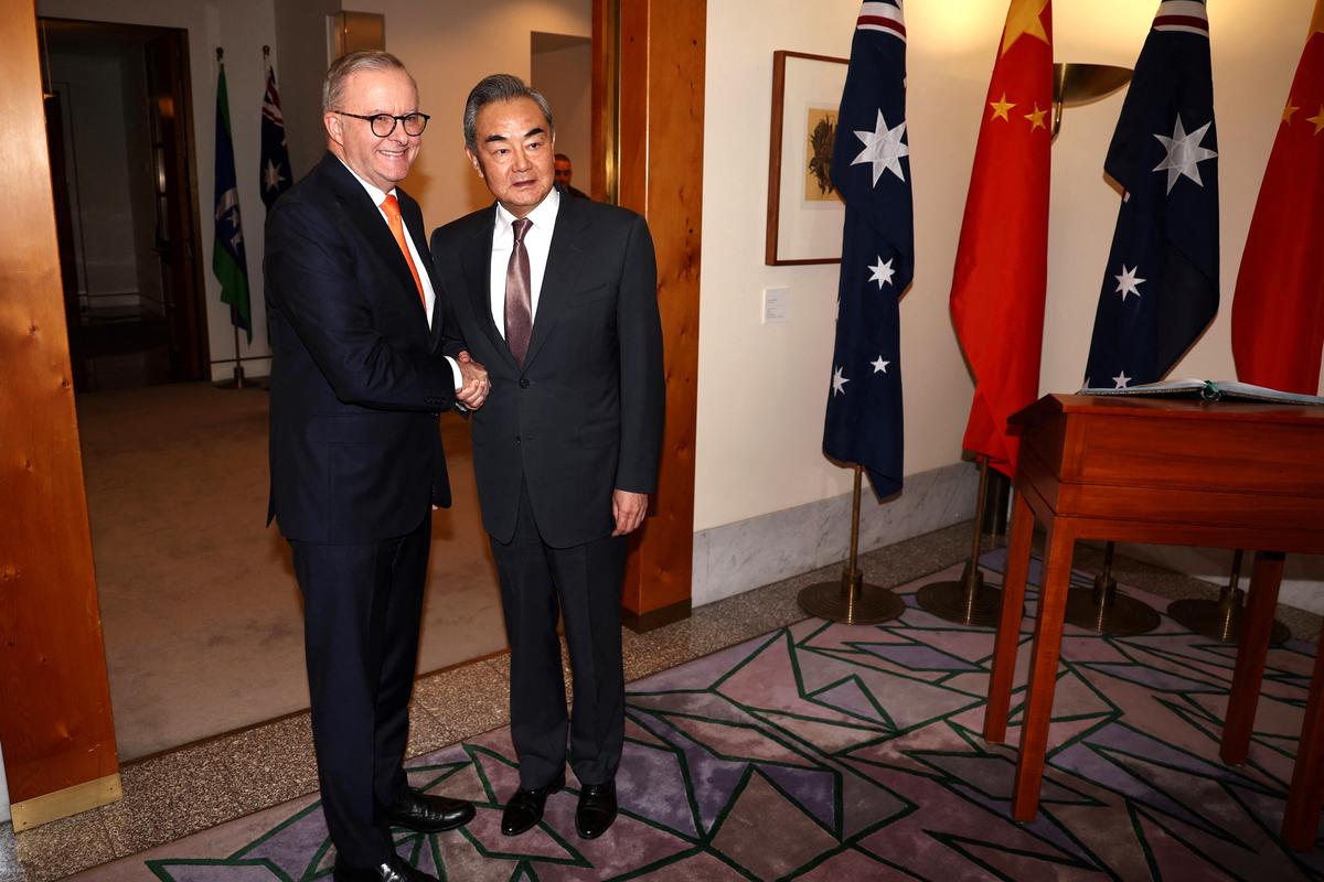Australian Prime Minister Anthony Albanese (L) receives Chinese Communist Party (CCP) Foreign Minister Wang Yi for a meeting in Canberra, Australia on March 20, 2024. (David Gray/AFP via Getty Images)