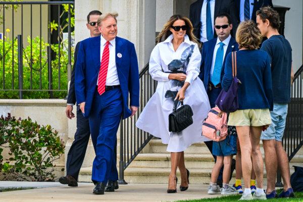 Former President and Republican presidential candidate Donald Trump and former First Lady Melania Trump smile after voting in Florida's primary election at a polling station at the Morton and Barbara Mandel Recreation Center in Palm Beach, Fla., on March 19, 2024. (Giorgio Viera /AFP via Getty Images)