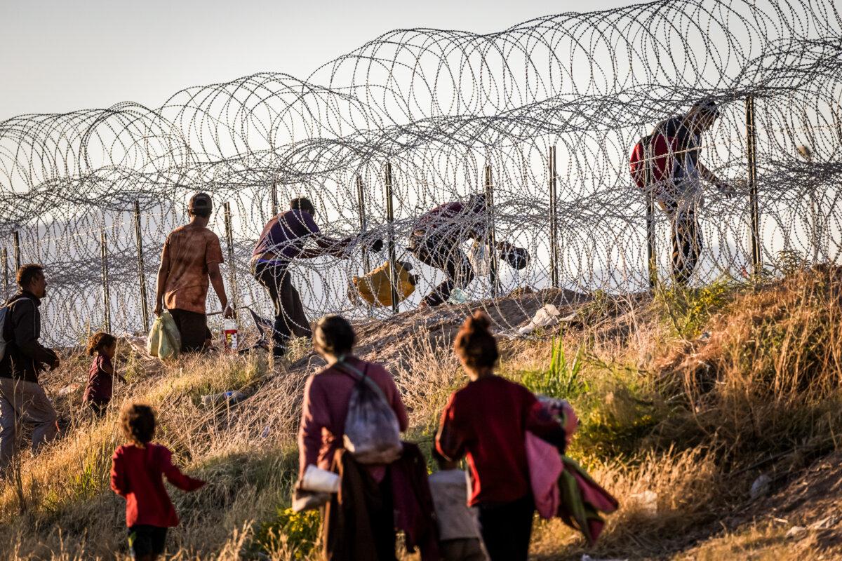 Illegal immigrants cross into the United States from Mexico to be processed by Border Patrol agents in El Paso, Texas, on May 8, 2023. (John Moore/Getty Images)