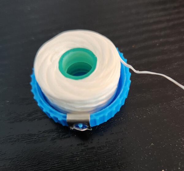Repurpose contact lens containers to save space when it comes to dental floss. (Myscha Theriault/TNS)