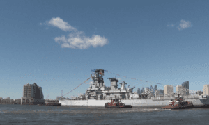 Crowds Watch Iconic Battleship Float Down Delaware River