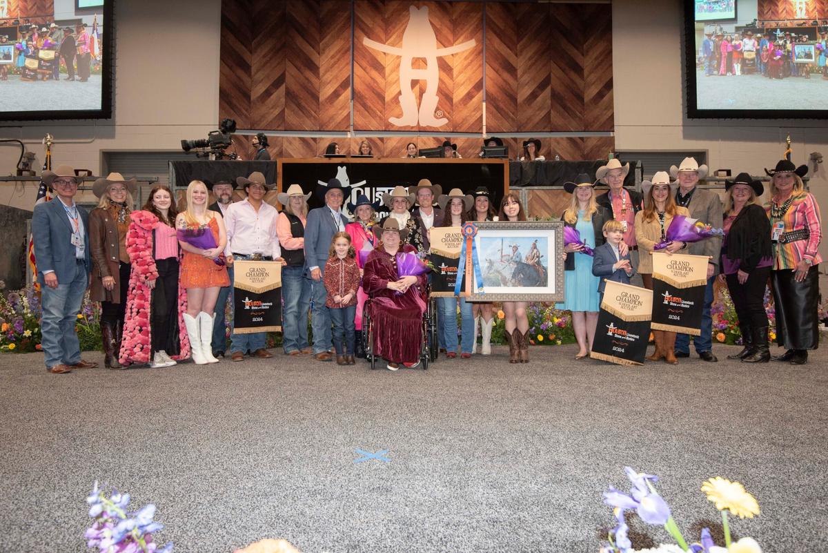 Members of the Houston Livestock Show and Rodeo committee, competition judges, and Ms. Hoffman pose after the award presentation ceremony. (Courtesy of The Hoffmans)