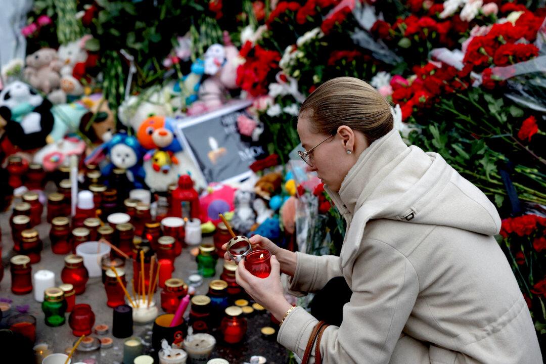 Russians Lower Flags in Mourning, Suspects Charged in Deadly Concert Hall Attack