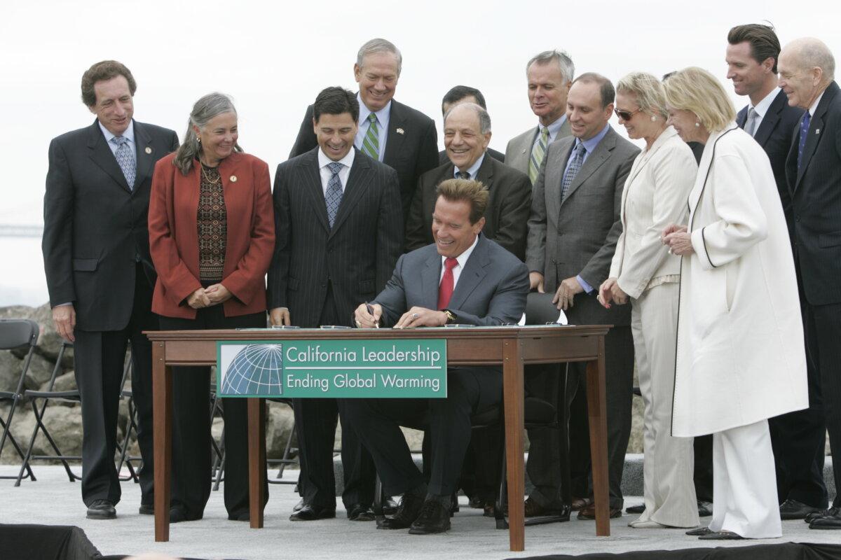 Then Gov. Arnold Schwarzenegger is joined by international environmental and industry leaders at a bill signing for AB 32 on Treasure Island in San Francisco on Sept. 27, 2006. (John Decker/Office of Governor Arnold Schwarzenegger)