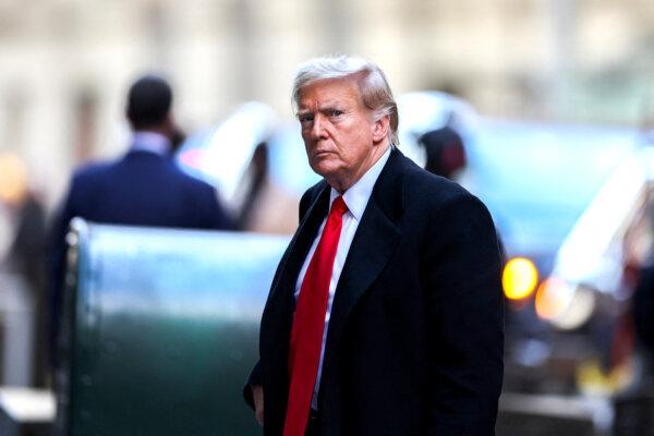 Former President Donald Trump arrives at 40 Wall Street after his court hearing to determine the date of his trial for allegedly covering up hush money payments linked to extramarital affairs, in New York City on March 25, 2024. (Charly Triballeau/AFP via Getty Images)