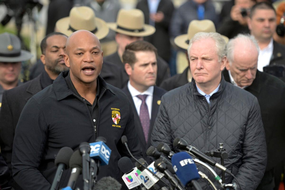 Maryland Gov. Wes Moore (L) speaks during a news conference as Sen. Chris Van Hollen (D-Md.) looks on near the scene where a container ship collided with a support on the Francis Scott Key Bridge in Baltimore on March 26, 2024. (Steve Ruark/AP Photo)