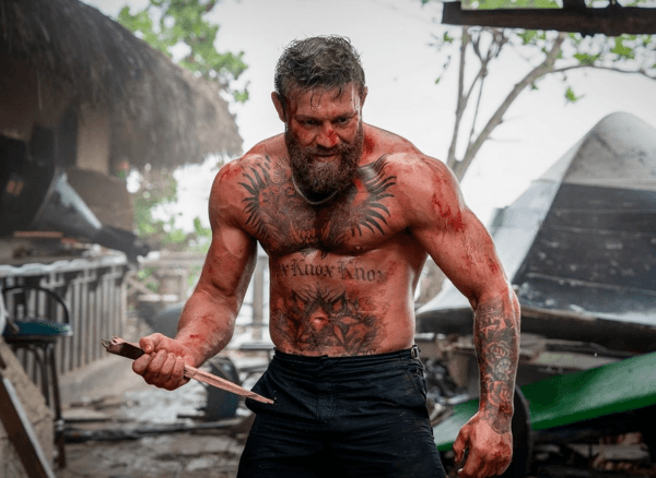 Knox (UFC star Conor MacGregor) imagining that he will put an end to Dalton (Jake Gyllenhaal) with a giant splinter, in "Road House." (Metro-Goldwyn-Mayer/Amazon MGM Studios)