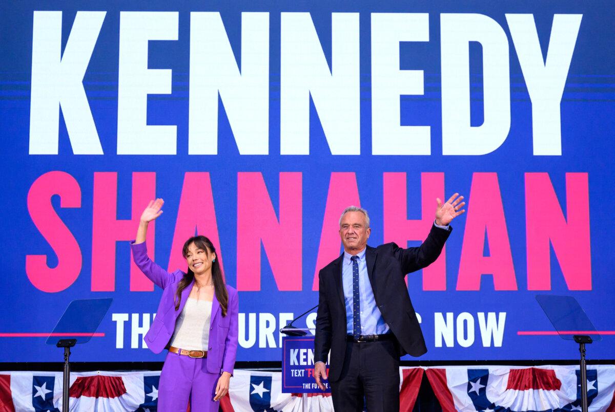 Presidential candidate Robert F. Kennedy Jr. (R) announces his running mate Nicole Shanahan (L) in Oakland, Calif., on March 26, 2024. (Josh Edelson/AFP via Getty Images)