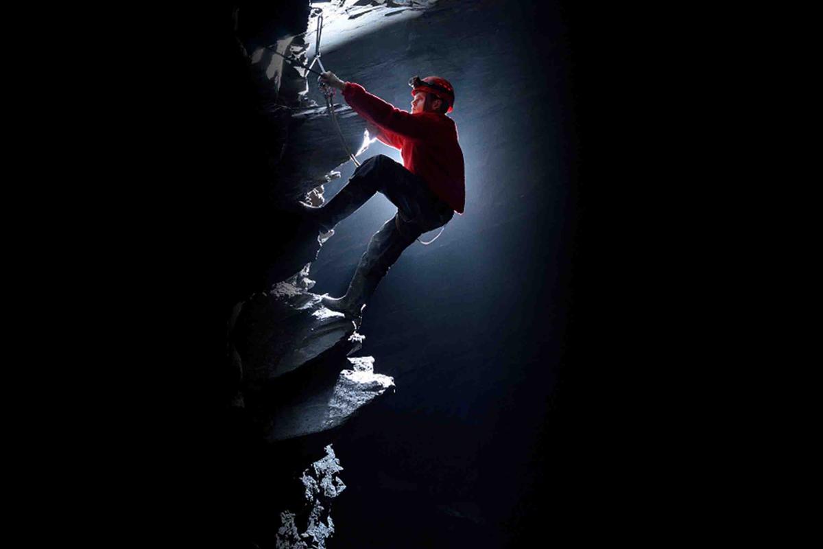 A climber explores Cwmorthin slate quarry. (Courtesy of <a href="https://www.go-below.co.uk/">Go Below Underground Adventures</a>)