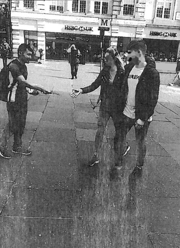 Undated handout photo issued by the Judicial Office of Abdul Ezedi (L) handing out church leaflets in the street, issued on March 26, 2024. (Judicial Office/PA Wire)