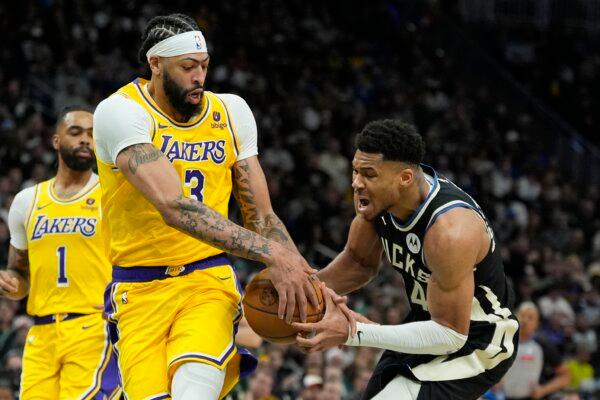 Los Angeles Lakers' Anthony Davis strips the ball from Milwaukee Bucks' Giannis Antetokounmpo during the second half of an NBA basketball game in Milwaukee on March 26, 2024. (Morry Gash/AP Photo)