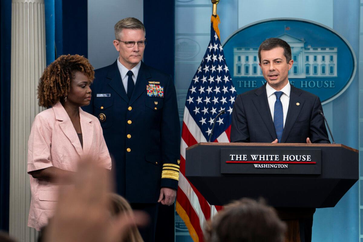 Secretary of Transportation Pete Buttigieg (R) speaks while Vice Admiral Peter Gautier, U.S. Coast Guard Deputy Commandant for Operations (C), and White House Press Secretary Karine Jean-Pierre (L) listen during a press briefing at the White House in Washington on March 27, 2024. (Madalina Vasiliu/The Epoch Times)