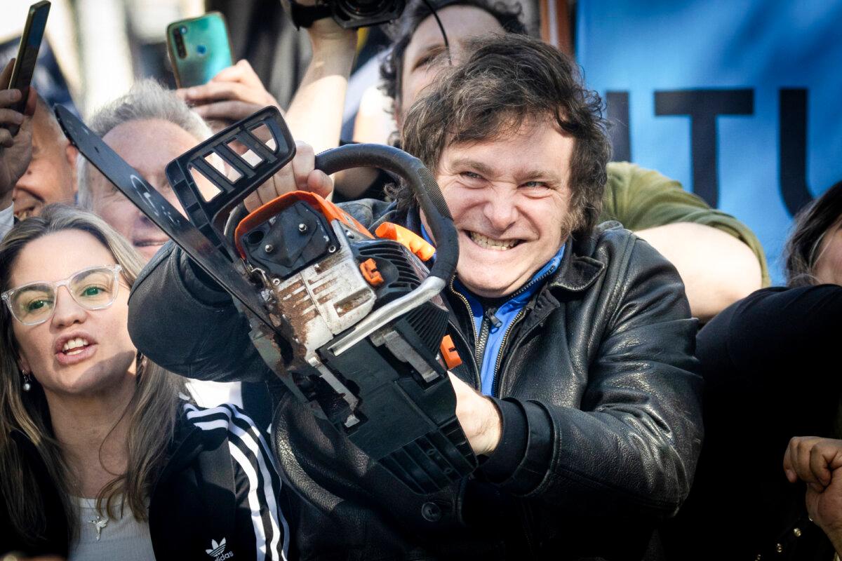 Then-Argentine presidential candidate Javier Milei lifts a chainsaw during a campaign rally in Buenos Aires, Argentina, on Sept. 25, 2023. (Tomas Cuesta/Getty Images)