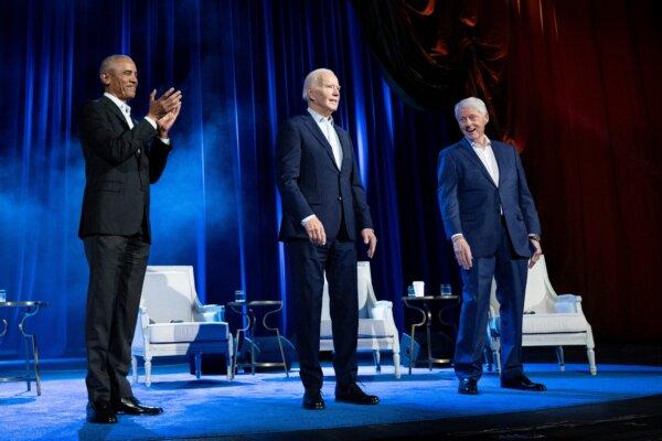 Former U.S. President Barack Obama (L) and former U.S. President Bill Clinton (R) cheer for U.S. President Joe Biden during a campaign fundraising event at Radio City Music Hall in New York City on March 28, 2024. (Brendan Smialowski/AFP via Getty Images)